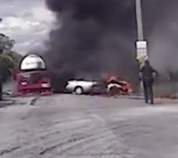 DASHCAM: Officer Pulls Woman from Burning Wreckage